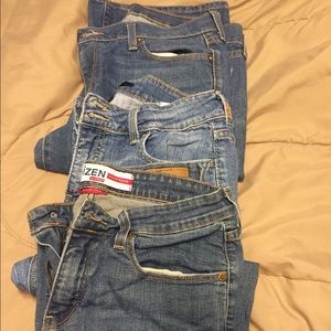 Bundle of three pairs of women’s jeans.